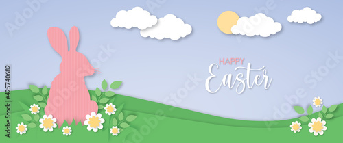 Easter bunny papercut vector, rabbit on meadow, spring cut out landscape, blue sky and clouds, easter holidays illustration
