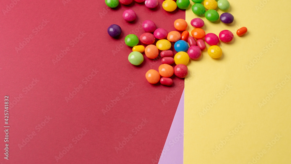 Obraz premium colorful little candies on a colored background