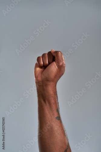 Fotografiet African american person raised hand clenched in fist