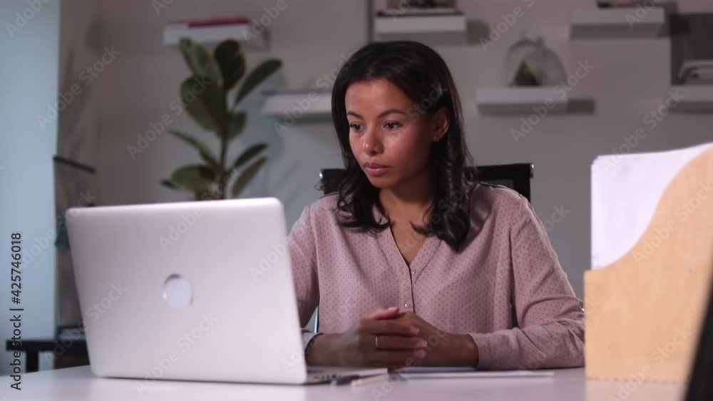 Businesswoman talking in front of laptop at table during distant conference in company spbi. Businesswoman talking in front of laptop at table during distant conference in company spbi.
