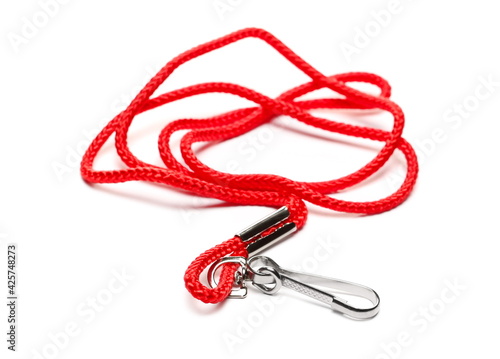 Carabiner keychain, shackle with red cord, rope isolated on white background