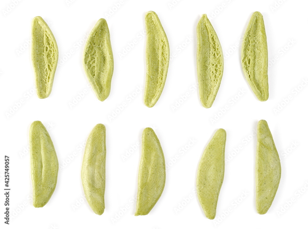 Dried durum pasta with spinach (foglie d'ulivo) in olive leaf shape set and collection isolated on white background, top view Dried durum pasta with spinach (foglie d'ulivo) in olive leaf shape set and collection isolated on white background, top view