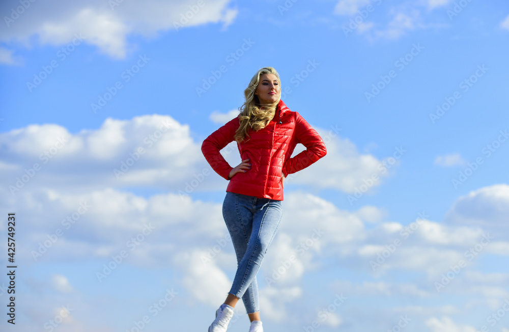 trendy girl in casual fall coat. autumn and spring style. Young and beautiful woman over sky background. above the clouds. looking far away, sense of freedom. future and success. lifestyle concept trendy girl in casual fall coat. autumn and spring style. Young and beautiful woman over sky background. above the clouds. looking far away, sense of freedom. future and success. lifestyle concept