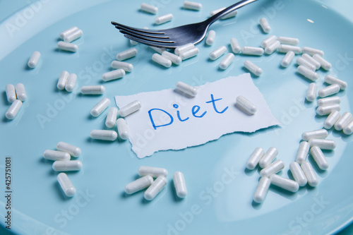 vitamins, supplements and tablets on a plate