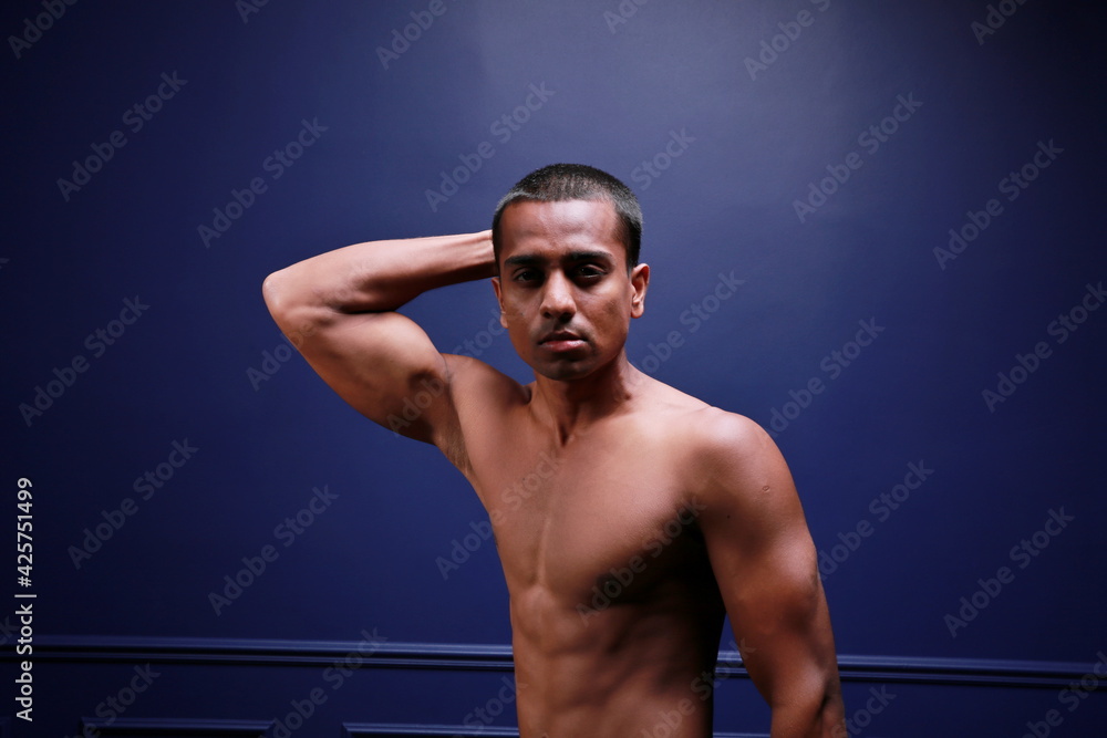 A young and masculine guy poses in the torso. A young and masculine guy poses in the torso.