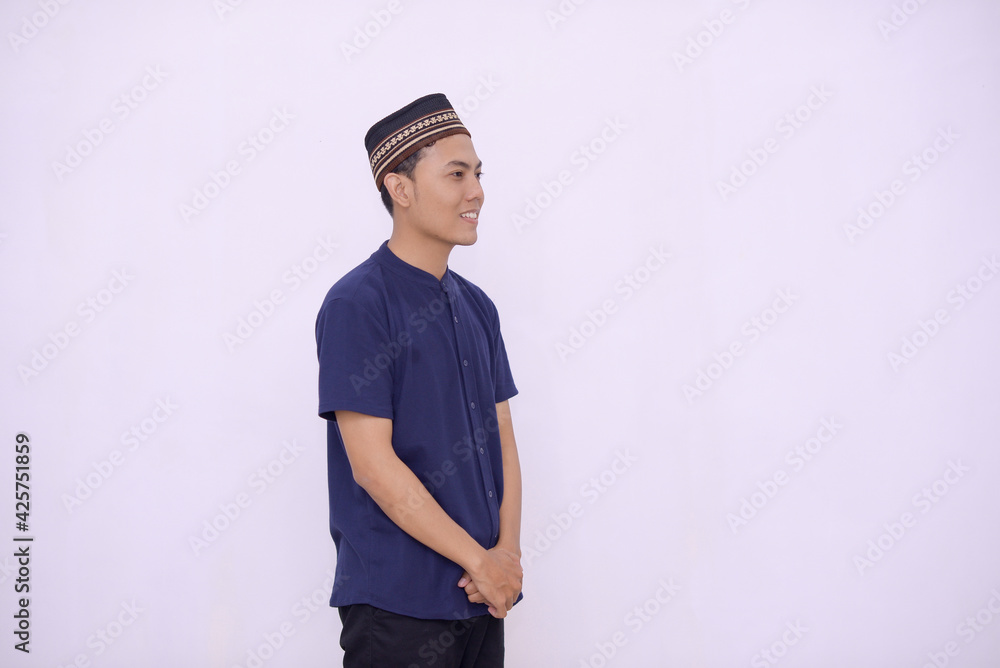 young asian muslim smilling to the camera isolated white background young asian muslim smilling to the camera isolated white background