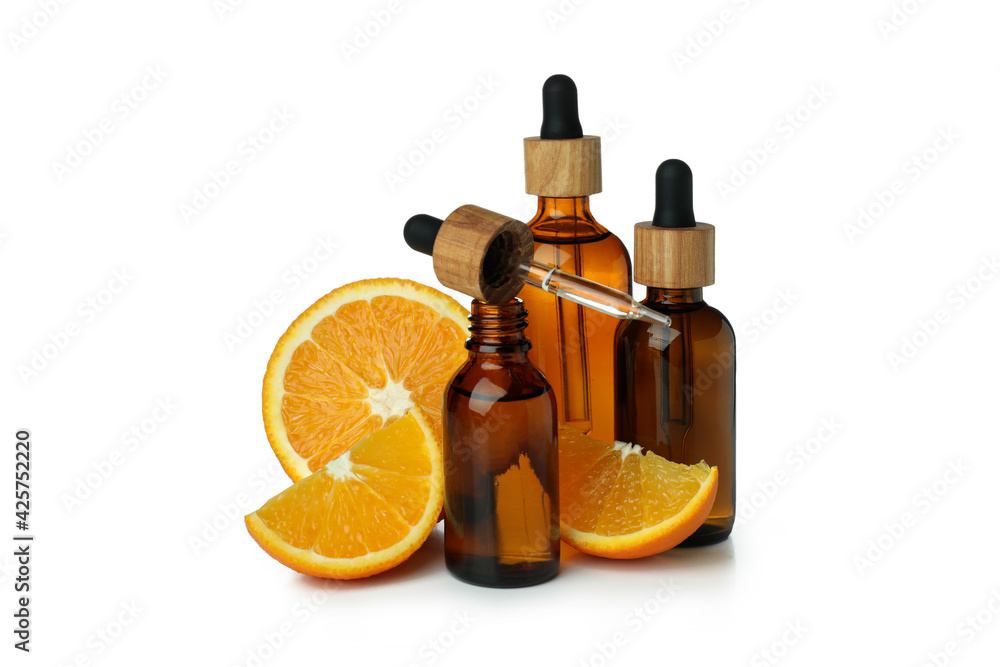 Dropper bottles with oil and orange isolated on white background Dropper bottles with oil and orange isolated on white background