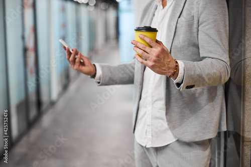 Close up of busy man checking email during break