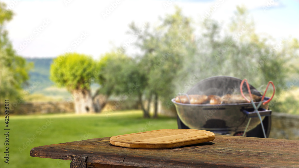 Desk of free space and grill in garden Desk of free space and grill in garden