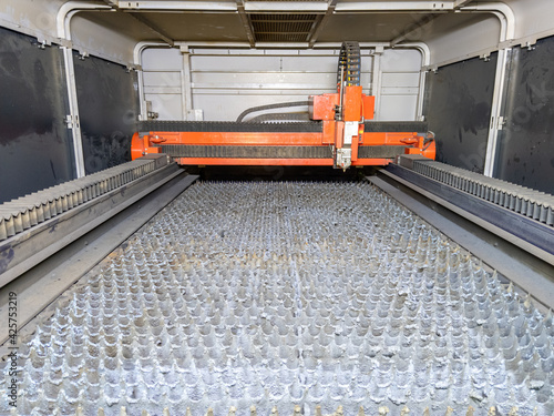 inside of empty cnc laser cutting machine - without workpiece metal sheet photo