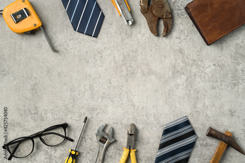 Top view design concept of Father's day with working tools on blue background.
