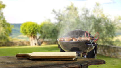 Table background of free space and grill in garden 