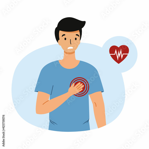 The man holds his hand in the heart area. Young man with heart pain, heart attack. Chest discomfort.