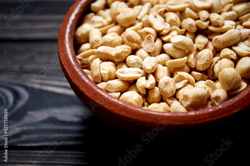 Nuts bowl on wooden background. Healthy vegan food.