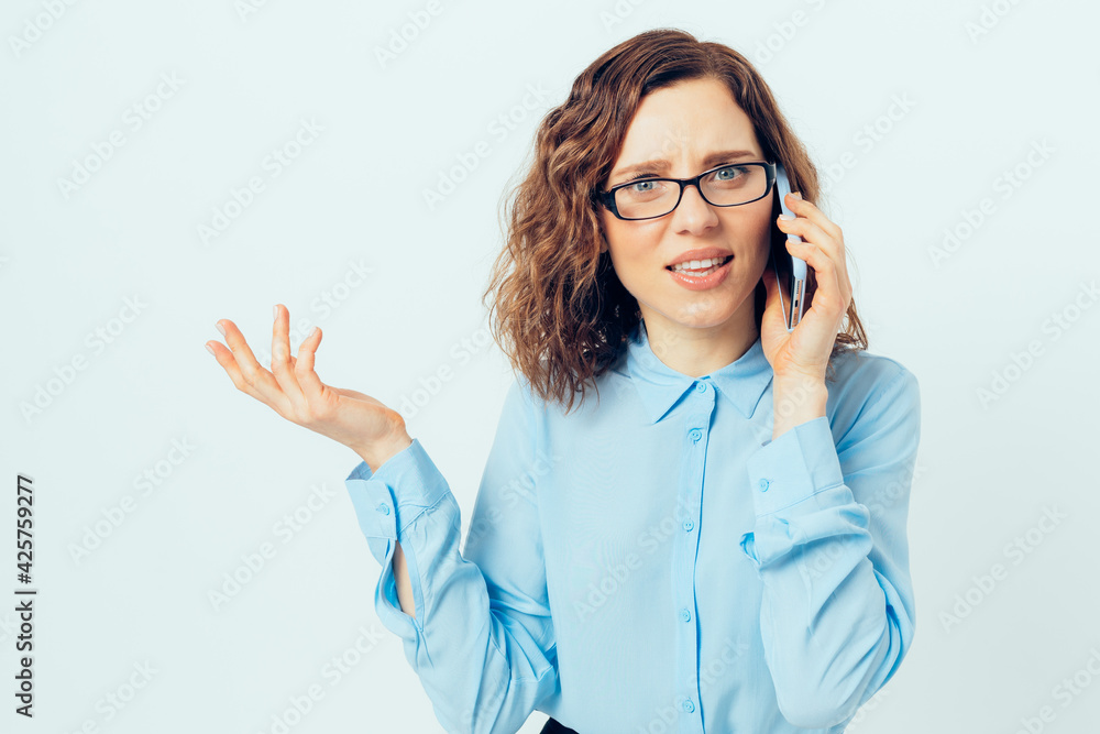 Portrait confused young business woman wearing glasses and blue shirt Portrait confused young business woman wearing glasses and blue shirt