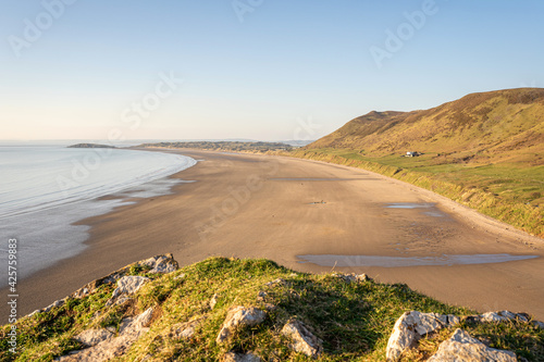 Rhossili bay beach on the Gower Peninsula, South Wales, UK before sunset, no people