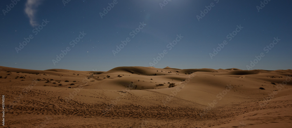 The dunes in the Sahara desert near Merzouga, Morocco , Africa. Beautiful sand landscape with stunning sky full of stars and night under a starry sky