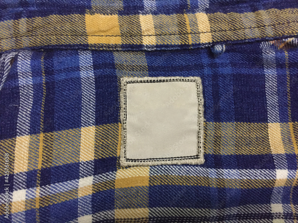 Clothing Label Mockup on blue and yellow check fabric texture ...