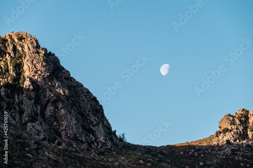 Waning Gibbous moon over mountains of Corsica