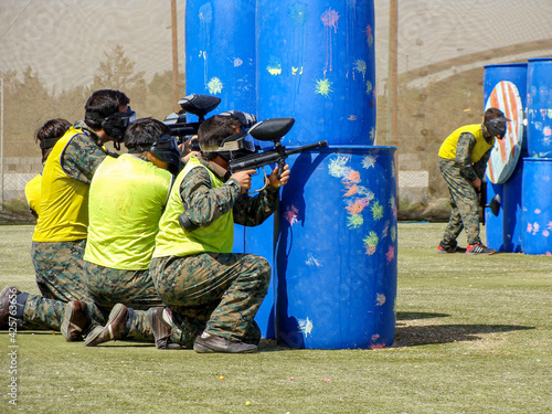 Covering and shooting from behind the trench in paintball "Tehran, Iran - August 7, 2013"