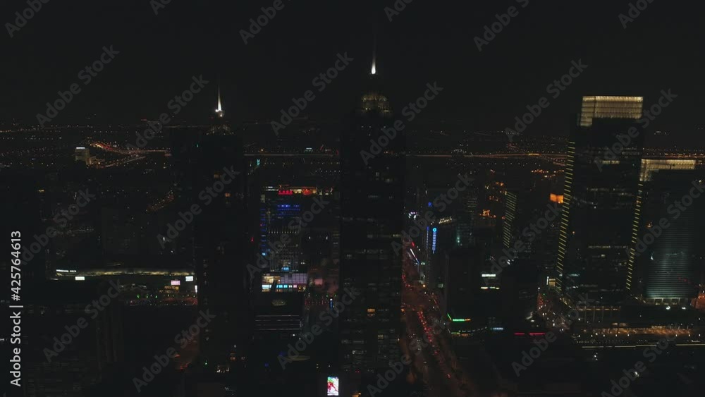 15 October, 2018. Suzhou city, China. Scenic aerial view of a modern city district at night with night traffic and illuminated skyscrapers, office buildings. 15 October, 2018. Suzhou city, China. Scenic aerial view of a modern city district at night with night traffic and illuminated skyscrapers, office buildings.