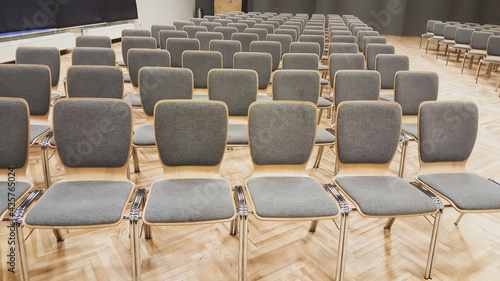 Empty auditorium with grey chairs  conference hall or house of culture