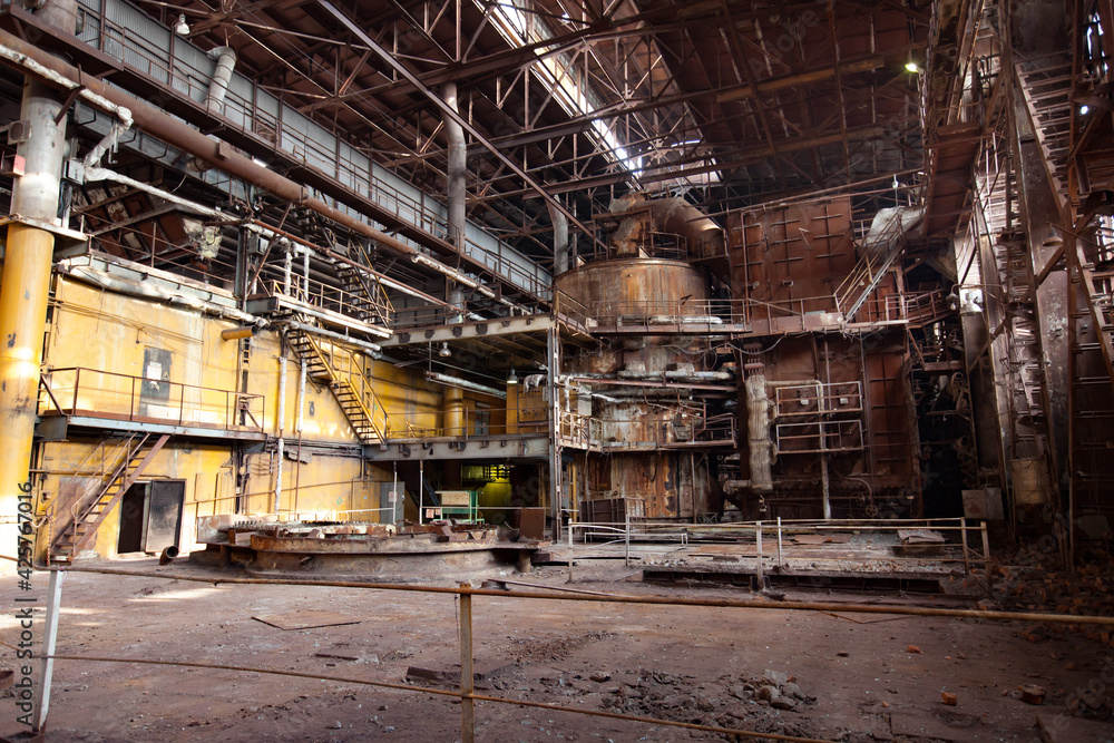 Stepnogorsk, Kazakhstan - April 04, 2012: Demolition of outdated Soviet sulfuric acid plant industrial building. Inside view.