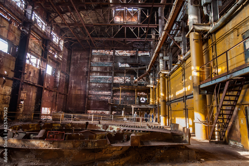 Stepnogorsk, Kazakhstan - April 04, 2012: Demolition of outdated Soviet sulfuric acid plant industrial building. Inside view.