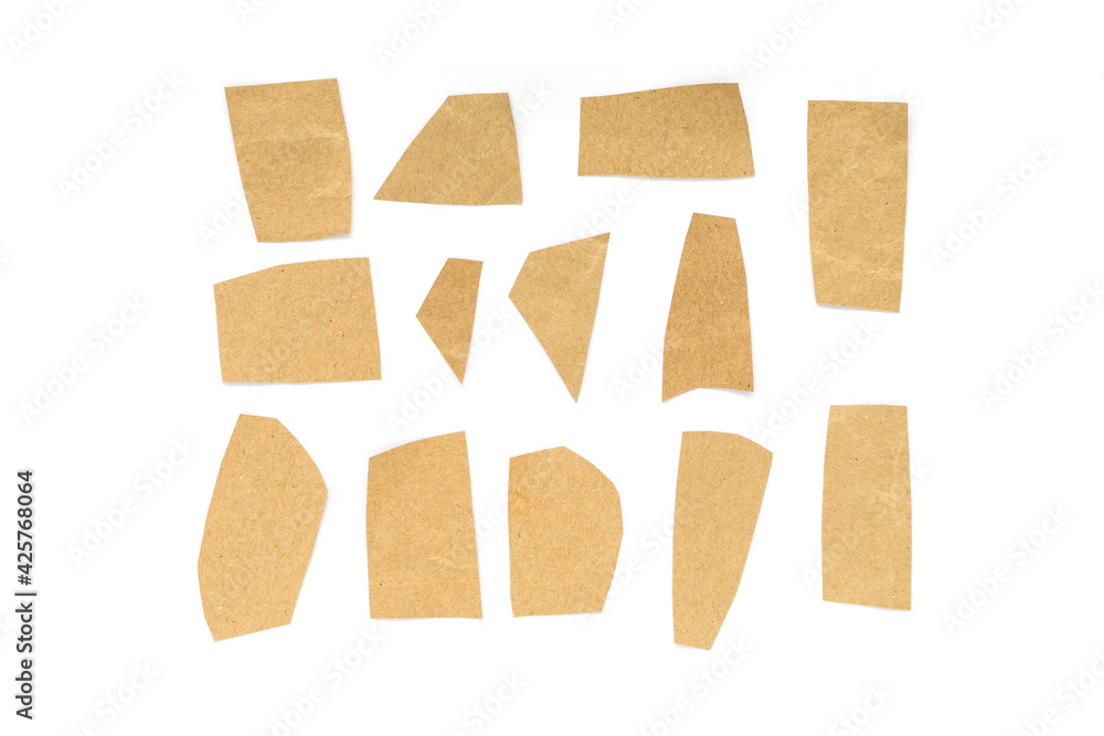 Recycled paper craft stick on a white background. Brown paper torn or ripped pieces of paper isolated on white background. Recycled paper craft stick on a white background. Brown paper torn or ripped pieces of paper isolated on white background.