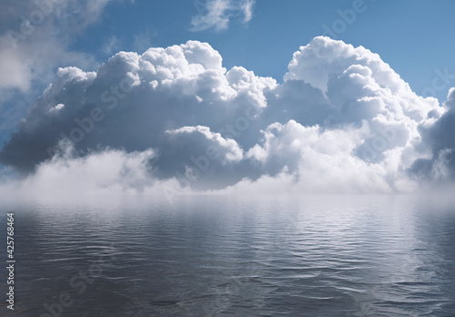 Sky with white clouds reflected in water.