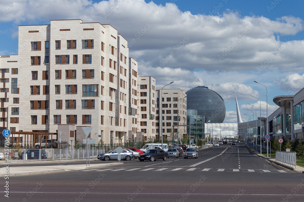 Nur-Sultan (Astana), Kazakhstan - 19.08.2017 - Expo town in the city of Nur-Sultan, the building of the muse sphere Nur-Alem is visible in the distance Nur-Sultan (Astana), Kazakhstan - 19.08.2017 - Expo town in the city of Nur-Sultan, the building of the muse sphere Nur-Alem is visible in the distance