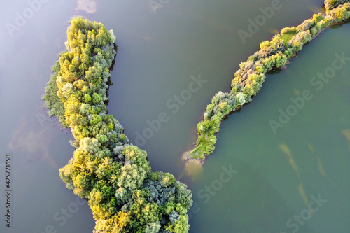Aerial view of freshwater lake with island, summer landscape