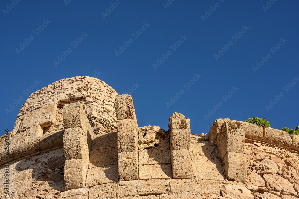 close up of old castle ruin with blue sky
