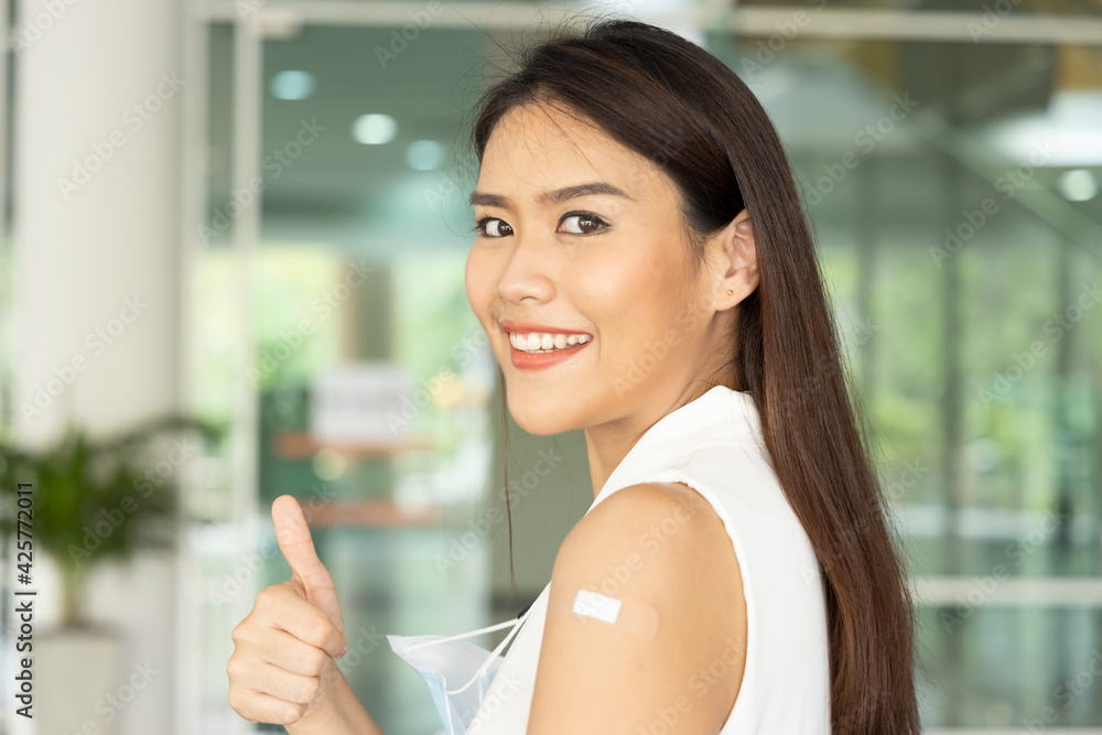 Healthy asian woman getting vaccinated immunity via vaccine program, concept of recommended inoculation, vaccination, vaccine for business office worker, vaccinated patient, herd immunity by vaccine