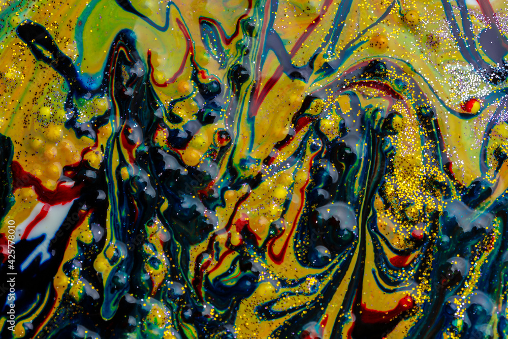 Liquid multicolored marble sprinkled with sparkles. Contemporary creativity. A colorful avant-garde painting with rich texture. A background made up of many shapes and materials.