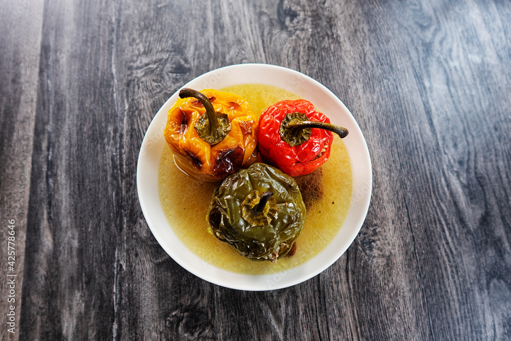 Roasted stuffed red pepper in a tray of food. Roasted stuffed red pepper in a tray of food.