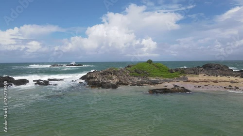 Rocky Outcrops At Sawtell Beach - White Fluffy Clouds Over South Pacific Ocean - NSW, Australia. - aerial photo