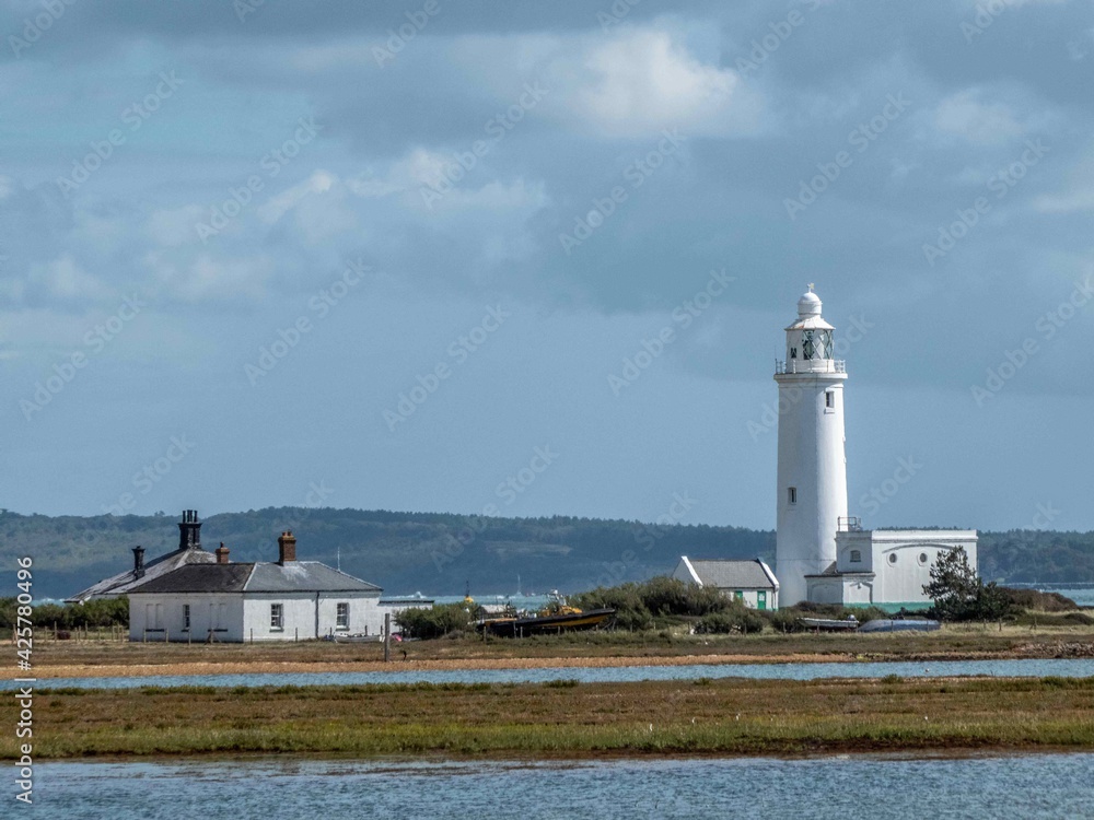 lighthouse at Hurst Point on a sunny autumn day