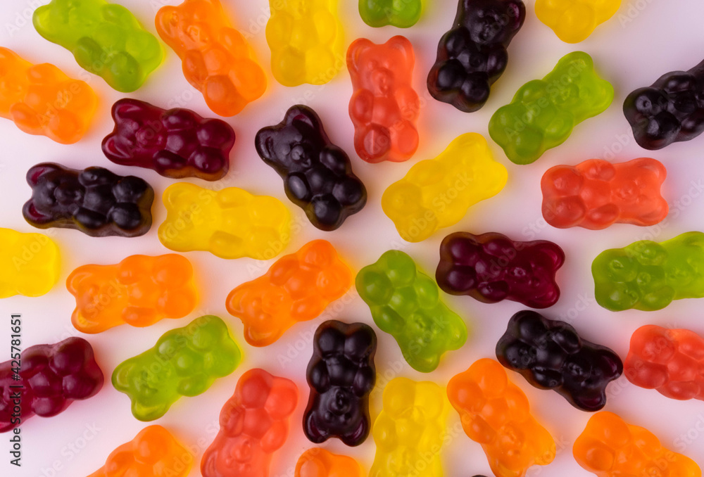 Bright multi-colored gummy bears. Background from jelly sweets. Bright multi-colored gummy bears. Background from jelly sweets.
