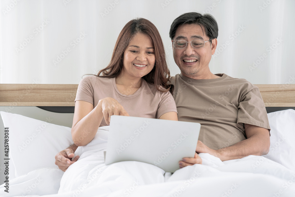 Asian elderly couple, Couple is enjoying spending time together at home, lockdown and quarantine lifestyle. Asian elderly couple, Couple is enjoying spending time together at home, lockdown and quarantine lifestyle.