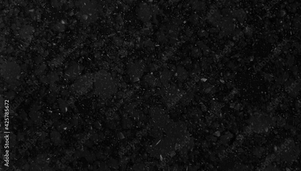 macro view of black grain granite stone texture with crystal pigments use as a background. dark black artificial stone background for interior material ,countertop or tabletop finishing.