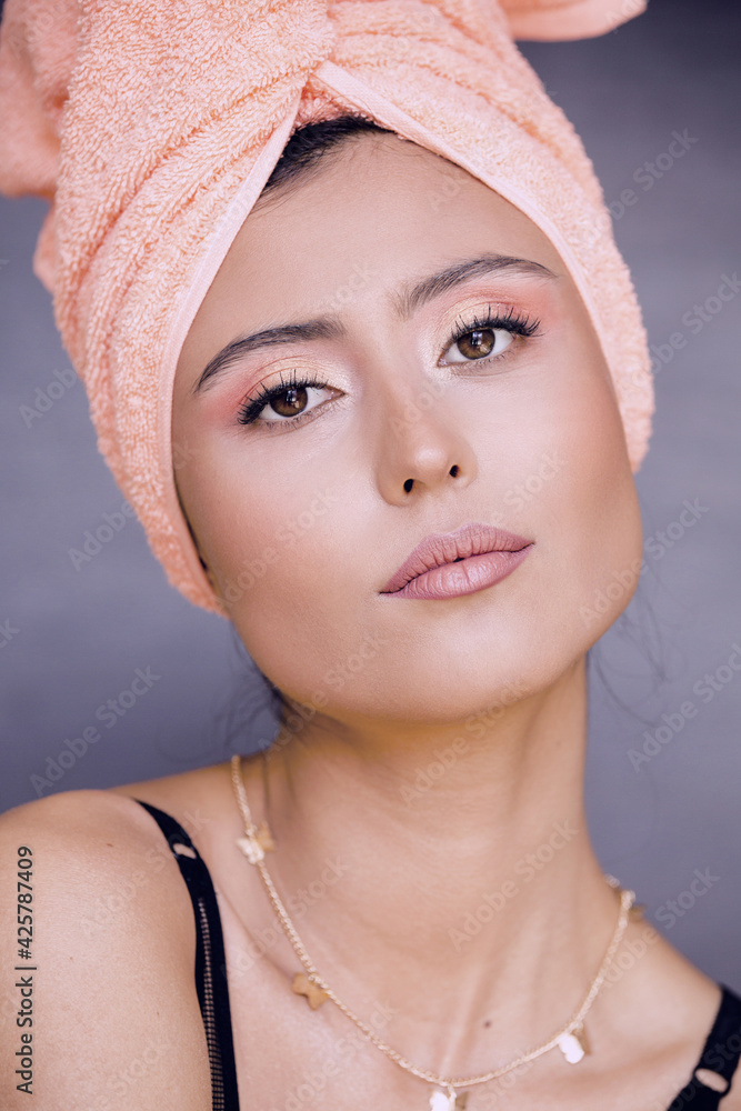 Fototapeta premium woman with pink make up at home. Get ready for going out