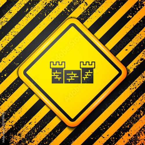 Black Great wall of China icon isolated on yellow background. Warning sign. Vector