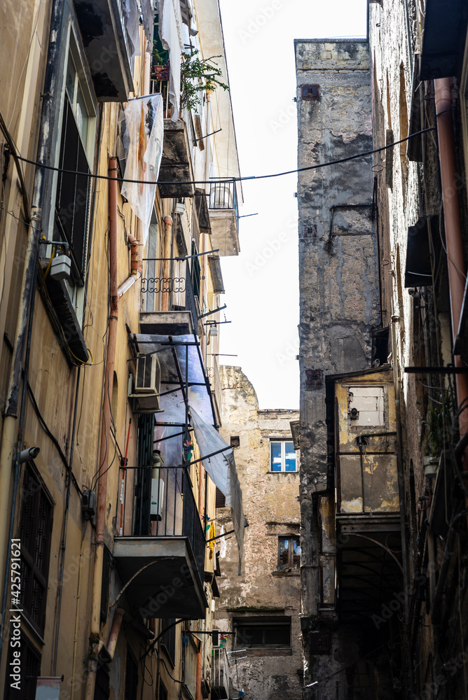 Narrow street in the old town of Naples, Italy