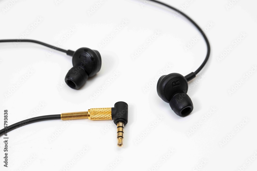 Top view in ear headphone isolate on white background , Black gold headphones.