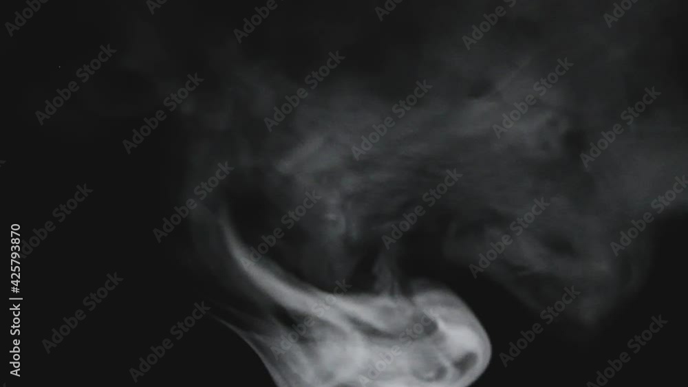 Puffs of smoke on a dark background Puffs of smoke on a dark background