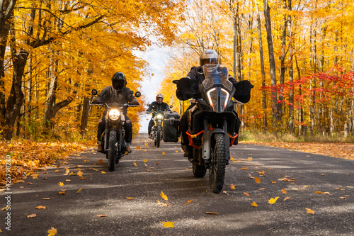 Obraz na płótnie Group of friends riding motorcycles in the fall in Canada w salonie