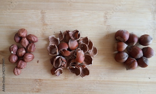 hazelnuts in shell, shell, peeled hazelnuts