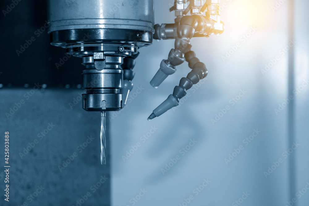 The machine reamer tool attached on the spindle of CNC milling machine. The hi-precision metalworking by machining center. The machine reamer tool attached on the spindle of CNC milling machine. The hi-precision metalworking by machining center.