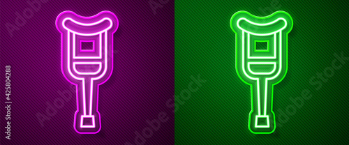 Glowing neon line Crutch or crutches icon isolated on purple and green background. Equipment for rehabilitation of people with diseases of musculoskeletal system. Vector